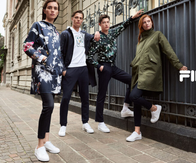 Fila Cina AW 2018 Advertising image shot in Milan by portrait, advertising and commercial photographer David Umberto Zappa. Talents posing in front of a fence in downtown Milan. Immagine pubblicitaria scattata da David Umberto Zappa, fotografo commerciale, pubblicitario, editoriale, a Milano.